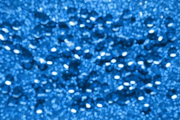 Classic  blue color 2020 year, glitter and bokeh on blue festive abstract background