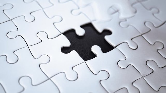 last piece of jigsaw filling by hand, step of success concept