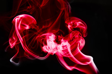 Obraz premium multicolored smoke photo against black background