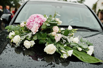 Elegance wedding limousine car with floral decoration.