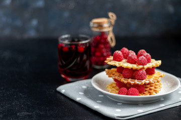 Traditional Belgian waffles with fresh fruits, sprinkled with powdered sugar and cocoa. You can eat for breakfast with compote or coffee. Holiday breakfast. Copy space.  