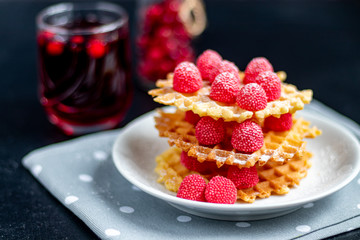 Traditional Belgian waffles with fresh fruits, sprinkled with powdered sugar and cocoa. You can eat for breakfast with compote or coffee. Holiday breakfast. Copy space.  