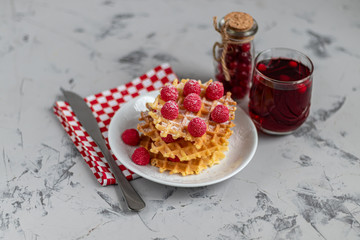 Traditional Belgian waffles with fresh fruits, sprinkled with powdered sugar and cocoa. You can eat...