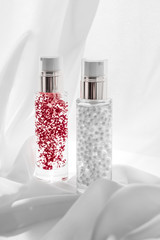 Skincare serum and make-up primer gel bottle, moisturizing lotion and lifting cream emulsion,...