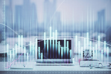 Forex Chart hologram on table with computer background. Multi exposure. Concept of financial markets.