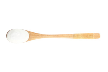 Wooden spoon with tasty organic yogurt isolated on white, top view