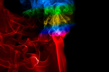 Fototapeta premium multicolored smoke photo against black background