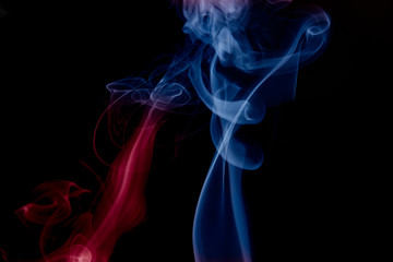 Obraz premium multicolored smoke photo against black background
