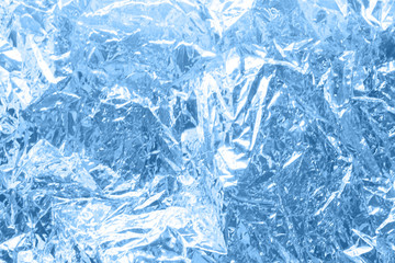 Classic blue color of the year 2020 Holographic abstraction - trendy colorful texture in pastel colors. Background 80s, 90s. Holographic foil. Hologram background texture wrinkled abstract 