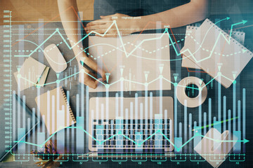 Financial graph displayed on woman's hand taking notes background. Concept of research. Multi exposure