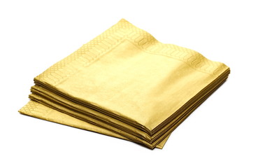 Golden paper napkins, serviette stack isolated on white background