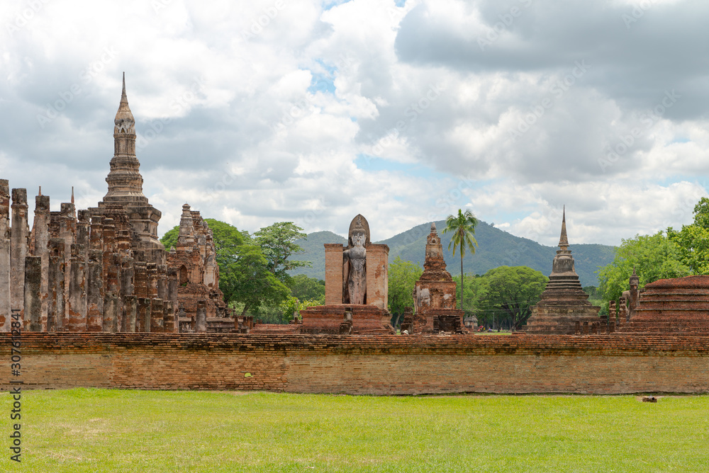 Wall mural view of buddha statue in sukhothai temple, thailand 2019