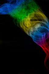 Obraz premium multicolored smoke photo against black background
