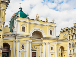 Naklejka premium The facade of Catholic Church of St Catherine with monumental arched portal on self-supporting columns and the massive cupola