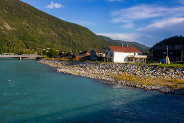 Beautiful river in norway. On the shore are houses