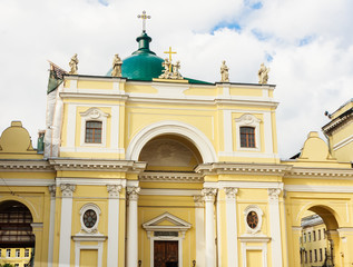 Fototapeta na wymiar The facade of Catholic Church of St Catherine with monumental arched portal on self-supporting columns and the massive cupola