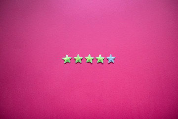 Service rating and service provision concept with star rating on pink background. Minimalism style