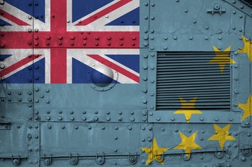 Tuvalu flag depicted on side part of military armored tank closeup. Army forces conceptual...
