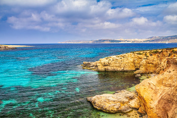 Turquoise lagoon between the islands of Comino and Gozo islands near Malta in the Mediterranean...