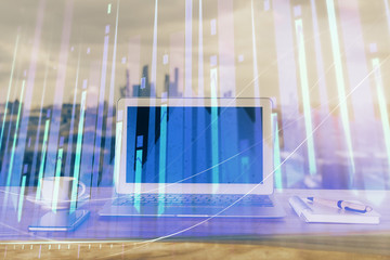 Forex Chart hologram on table with computer background. Double exposure. Concept of financial markets.