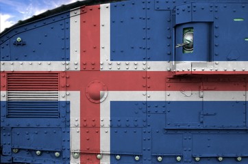 Iceland flag depicted on side part of military armored tank closeup. Army forces conceptual...