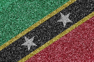 Saint Kitts and Nevis flag depicted on many small shiny sequins. Colorful festival background for...