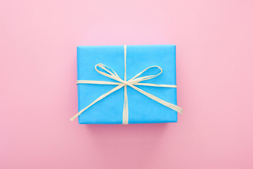 top view of wrapped blue present on pink