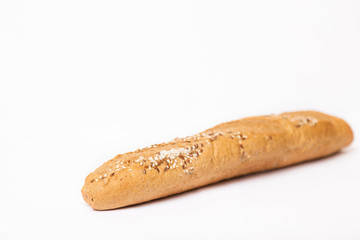 French baguette with sesame seeds on a white background