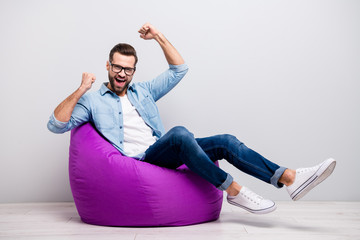 Full size photo of crazy guy watch tv sitting comfortable soft violet armchair celebrate football...