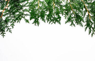 Christmas and New Year background with thuja branch, decorations and presents wrapped in craft paper with snowflakes. Flat lay, top view