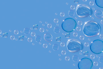 A stream of soap bubbles. Soap bubbles fly in the sky. Blow out soap bubbles.