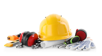 Different construction tools and hard hat isolated on white