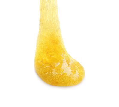 Flowing yellow slime isolated on white. Antistress toy