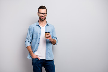 Photo of business macho guy young boss holding hot takeout coffee beverage walking office morning...