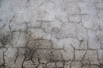 Cracked cement wall. Old wall with cracks. A Grey wall