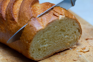 Slicing a loaf on a cutting board