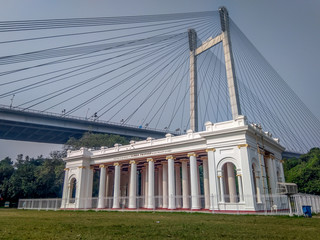 A view of Prinsep Ghat built in 1841 in memory of Anglo-Indian scholar James Prinsep with vidyasagar setu (bridge) in background.