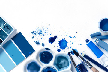 Background with art supplies and classic blue colors