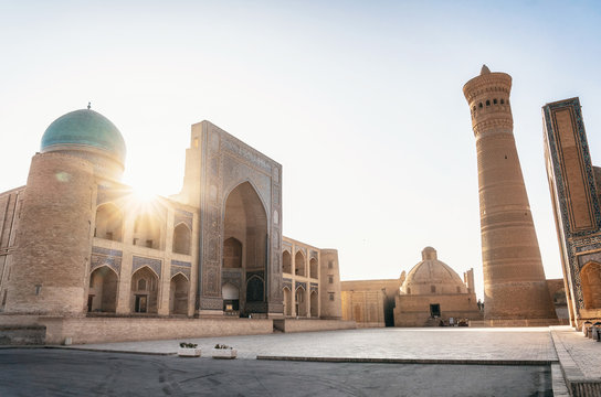 View islamic religious complex of Poi Kalan located around the Kalan minaret in Bukhara at sunrise, Uzbekistan