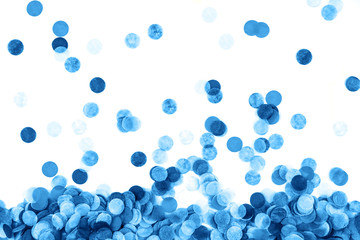Blue confetti background. Flat lay style. Festive concept