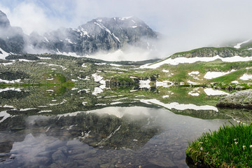large cold lake high in the caucasus mountains