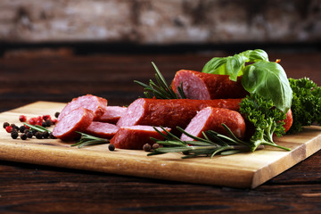 sausage slices, smoked meat product (tasty snack salami) menu concept. food background with cracow sausages
