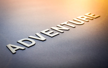 Fototapeta premium Word adventure written with white solid letters
