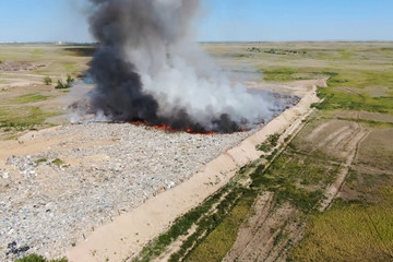 Burning trash. fire at the landfill. Burning garbage.