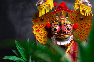 colorful replica barong bali with a black background