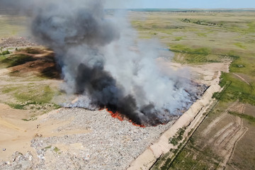 Burning trash. fire at the landfill. Burning garbage.