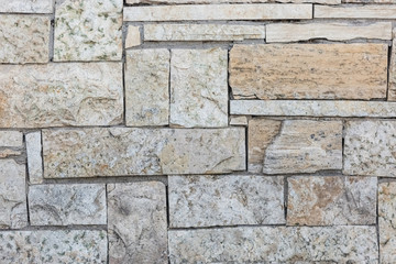 A wall of craggy stone. Background for design.