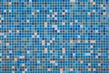 Background of blue, white, ceramic tiles. The texture of the tiles.