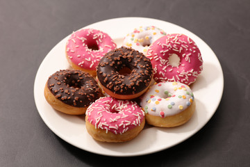 collection of donut with various icing
