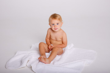 Infant baby toddler in diaper sitting crawling back happy smile on white background